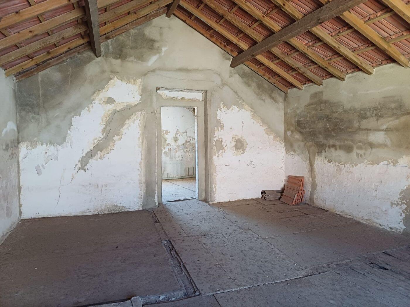 Beamed attic space with terracotta tiles