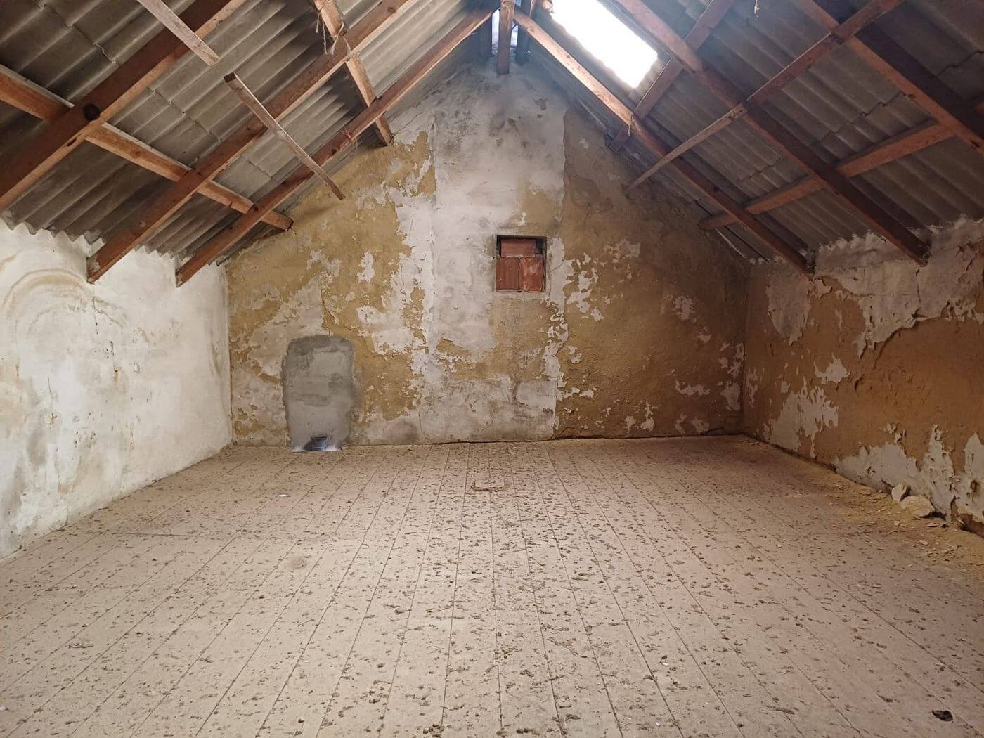 Attic room with exposed A-frame beams
